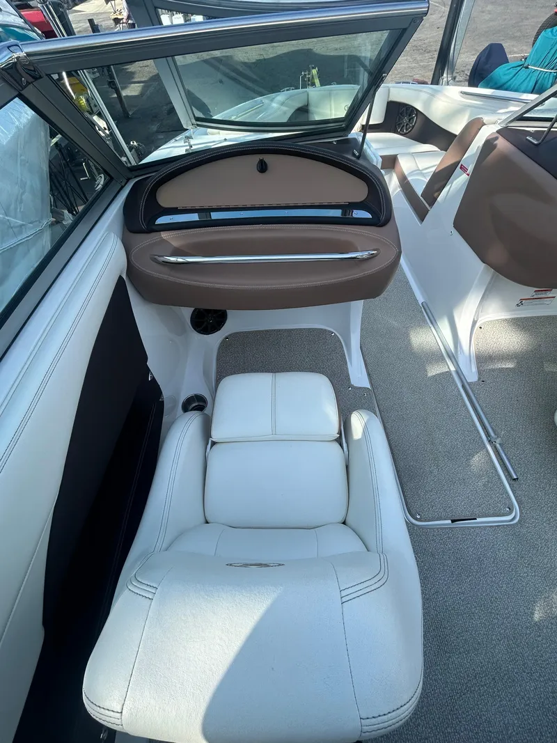 Slide: The Image of 2012 Cobalt 210 WSS boat interior with white seating and open windshield. - 4