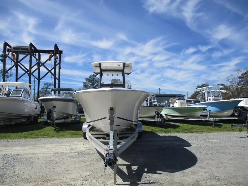 Slide: The Image of 2025 Sea Fox 248 Commander boat on trailer under a clear blue sky. - 1