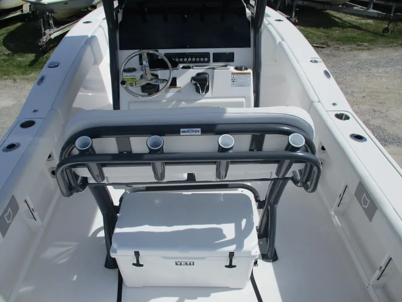 Slide: The Image of 2025 Sea Fox 248 Commander boat interior with steering console and seating. - 10