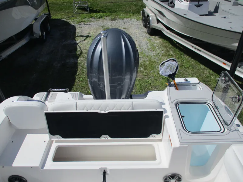Slide: The Image of 2025 Sea Fox 248 Commander boat interior with motor and storage compartments. - 12