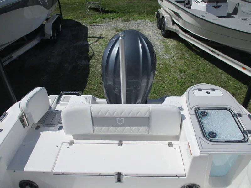 Slide: The Image of 2025 Sea Fox 248 Commander boat interior with engine and seating area. - 13