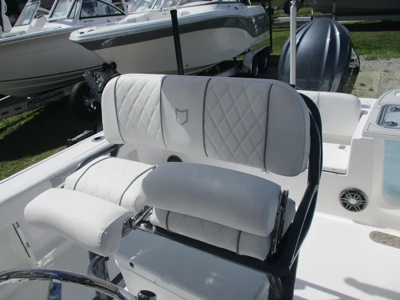 Slide: The Image of 2025 Sea Fox 248 Commander boat with luxurious white seating and sleek design. - 14