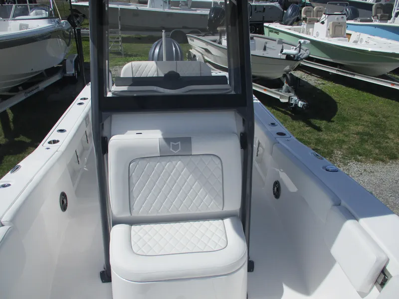 Slide: The Image of 2025 Sea Fox 248 Commander boat interior with white seating and console. - 15
