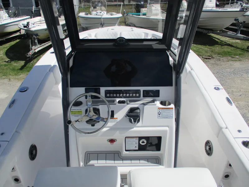 Slide: The Image of 2025 Sea Fox 248 Commander boat console with steering wheel and controls. - 16
