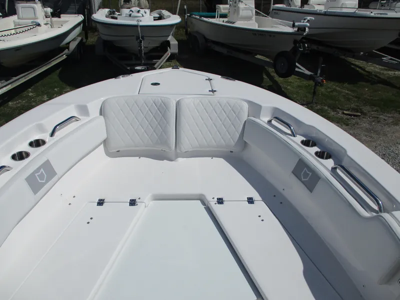 Slide: The Image of 2025 Sea Fox 248 Commander boat interior with cushioned seating and cup holders. - 9