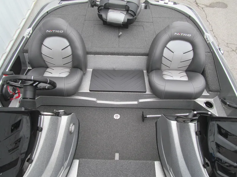 Slide: The Image of 2021 Nitro Z17 boat interior with gray seating and steering wheel. - 11