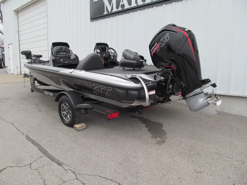 Slide: The Image of 2021 Nitro Z17 boat with powerful outboard motor, parked outside a building. - 3