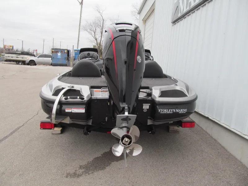 Slide: The Image of 2021 Nitro Z17 boat, rear view, parked outside a marine shop. - 4