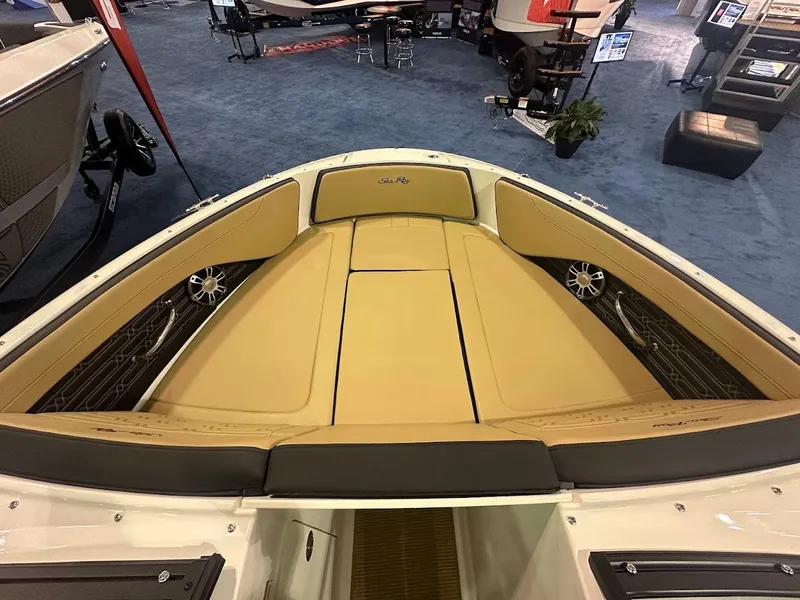 Slide: The Image of 2025 Sea Ray SPX 190 boat interior with tan seating and sleek design. - 18