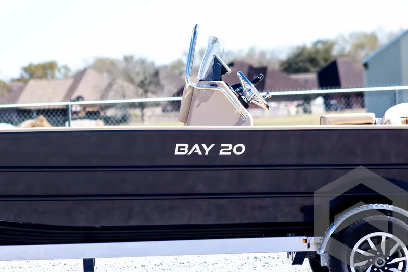 Slide: The Image of 2025 G3 Bay 20 boat on trailer, side view with steering console visible. - 10