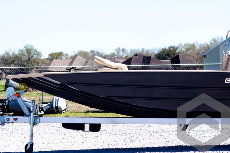Slide: The Image of 2025 G3 Bay 20 boat on trailer, outdoor setting, side view. - 11