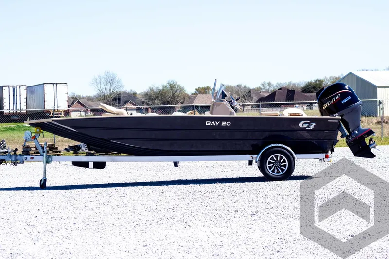Slide: The Image of 2025 G3 Bay 20 boat on trailer, parked outdoors on gravel. - 12