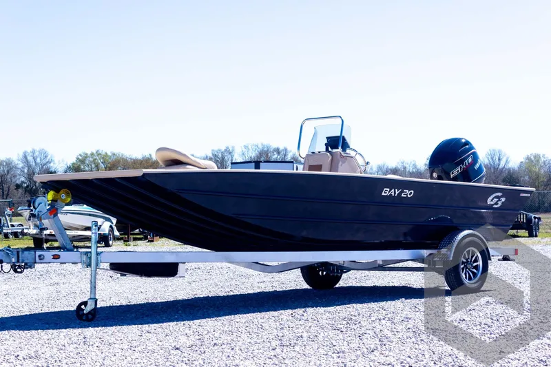 Slide: The Image of 2025 G3 Bay 20 boat on trailer, parked outdoors, side view. - 13