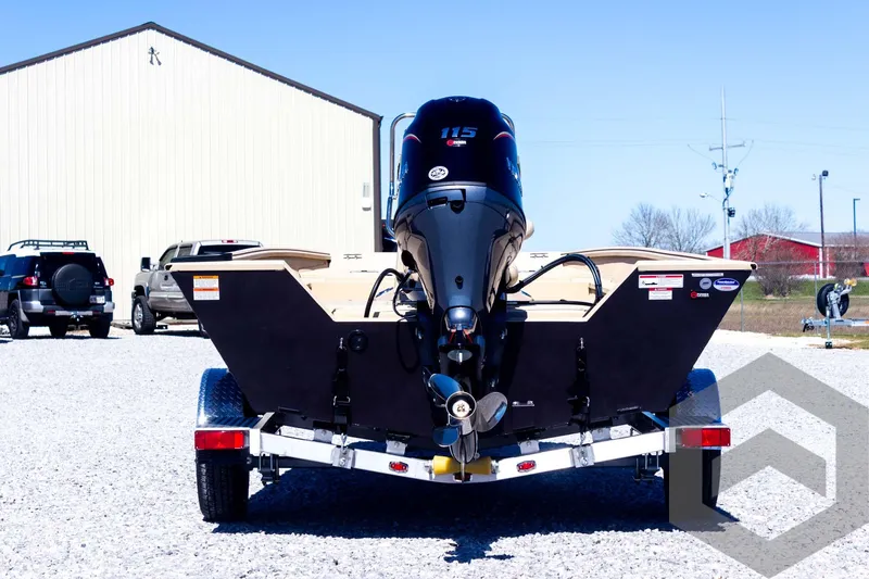 Slide: The Image of 2025 G3 Bay 20 boat on trailer, rear view with outboard motor, parked outdoors. - 18