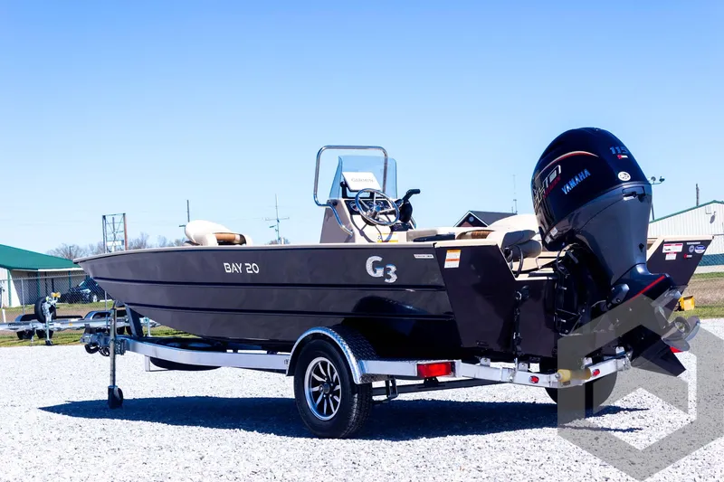 Slide: The Image of 2025 G3 Bay 20 boat on trailer with Yamaha outboard motor, parked on gravel. - 19