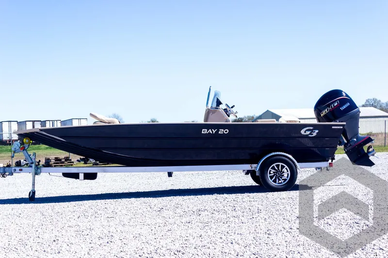 Slide: The Image of 2025 G3 Bay 20 boat on trailer, side view, outdoors. - 20