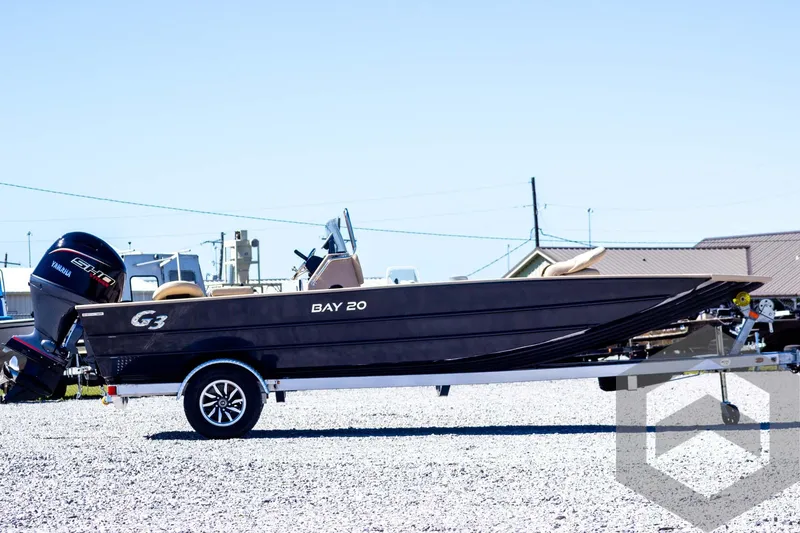 Slide: The Image of 2025 G3 Bay 20 boat on trailer, side view, outdoors, clear sky. - 4