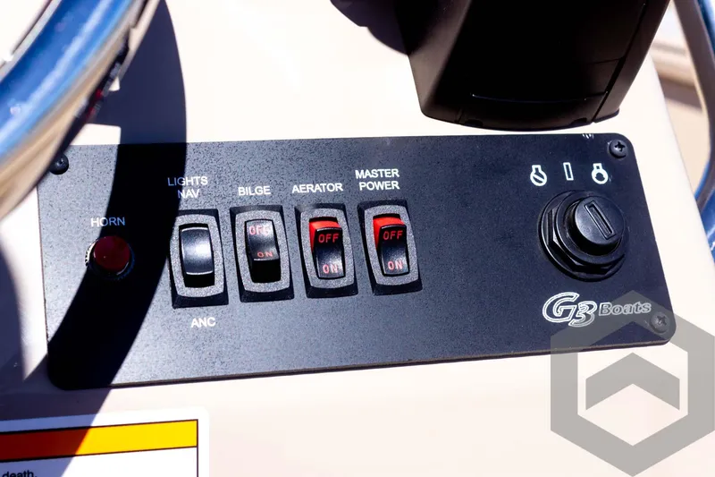 Slide: The Image of Control panel of 2025 G3 Bay 20 boat with switches and logo. - 41
