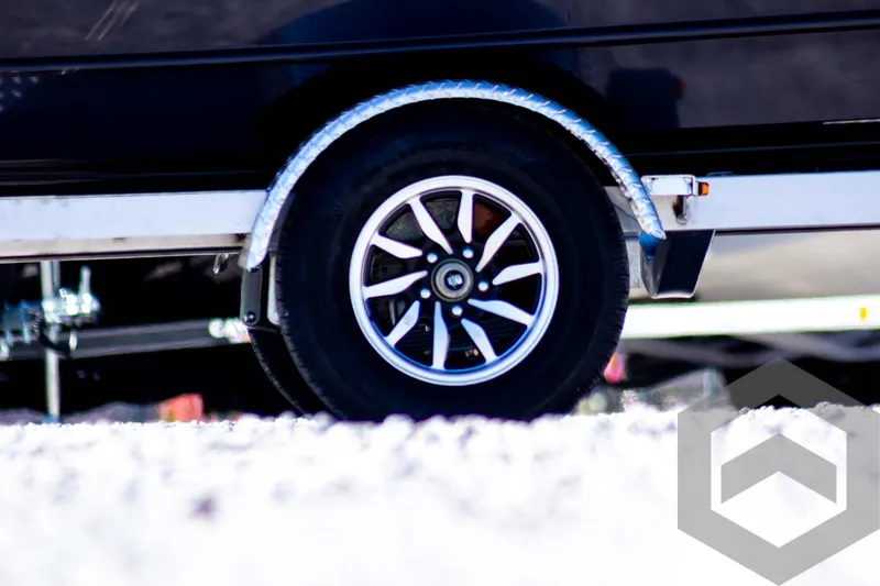 Slide: The Image of 2025 G3 Bay 20 trailer wheel on snowy ground. - 5