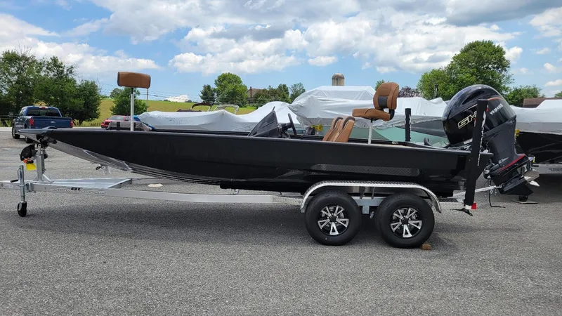 The Image of 2026 Xpress H20 Bass boat with Yamaha Vmax 175 engine on trailer, outdoors. - 1
