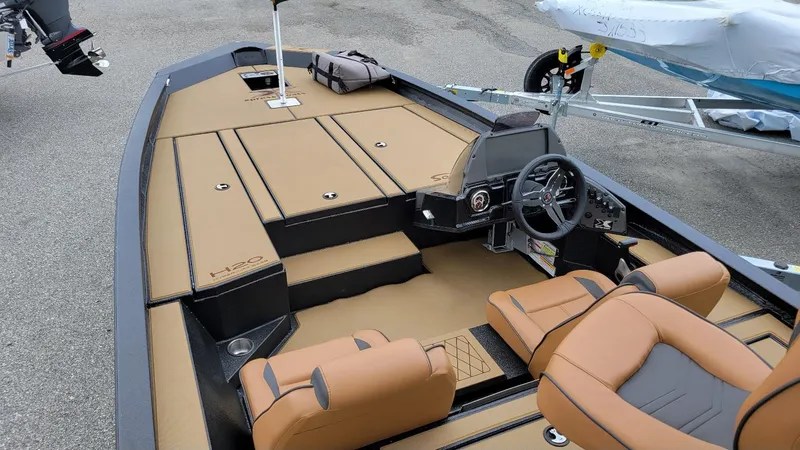 Slide: The Image of 2026 Xpress H20 Bass boat with Yamaha Vmax 175, featuring tan interior and modern console. - 11
