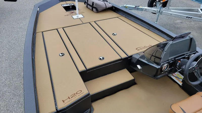 Slide: The Image of 2026 Xpress H20 Bass boat interior with Yamaha Vmax 175, featuring tan SeaDek flooring. - 12