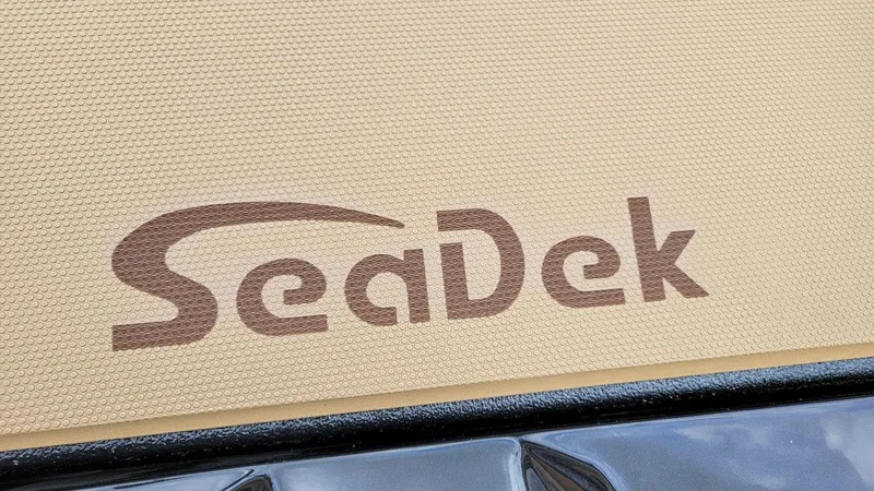 Slide: The Image of SeaDek logo on textured surface of 2026 Xpress H20 Bass boat. - 13