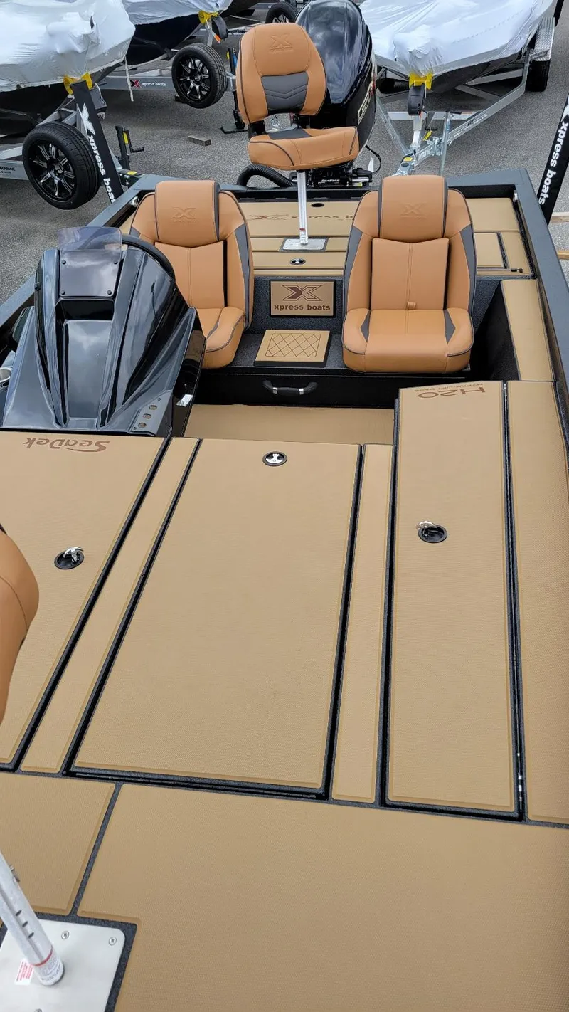 Slide: The Image of 2026 Xpress H20 Bass boat with Yamaha Vmax 175, tan interior, dual seats. - 14