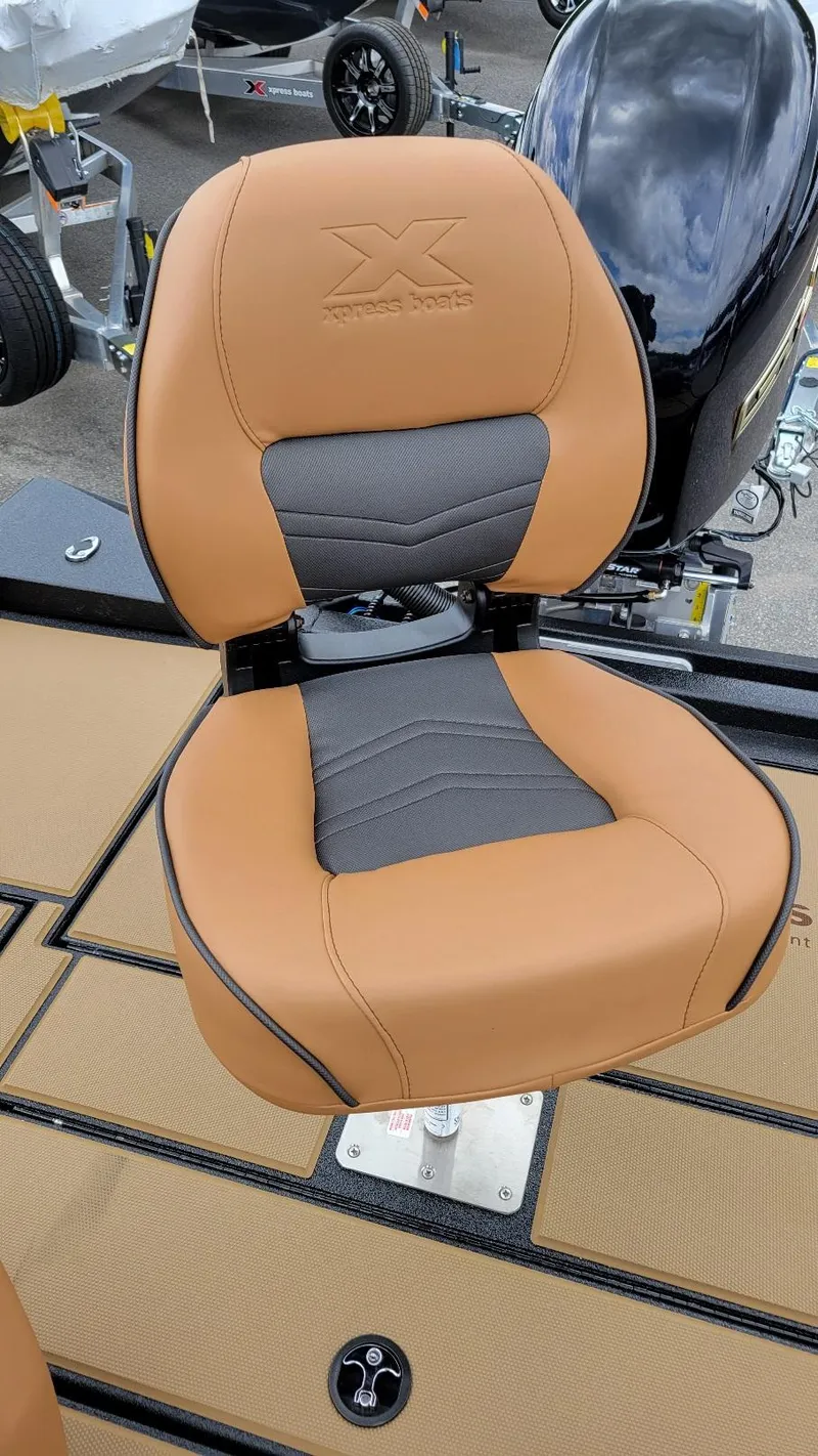 Slide: The Image of 2026 Xpress H20 Bass boat seat with Yamaha Vmax 175 engine, tan and gray upholstery. - 16