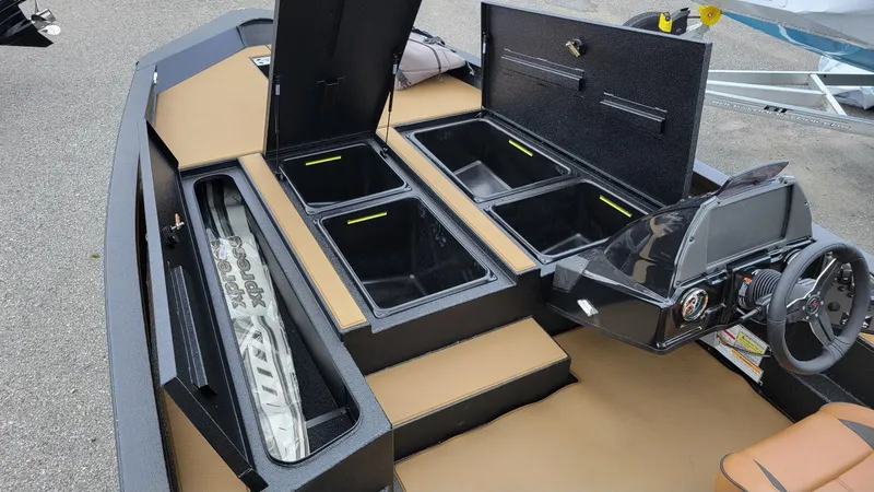 Slide: The Image of 2026 Xpress H20 Bass boat interior with storage compartments and steering console. - 5
