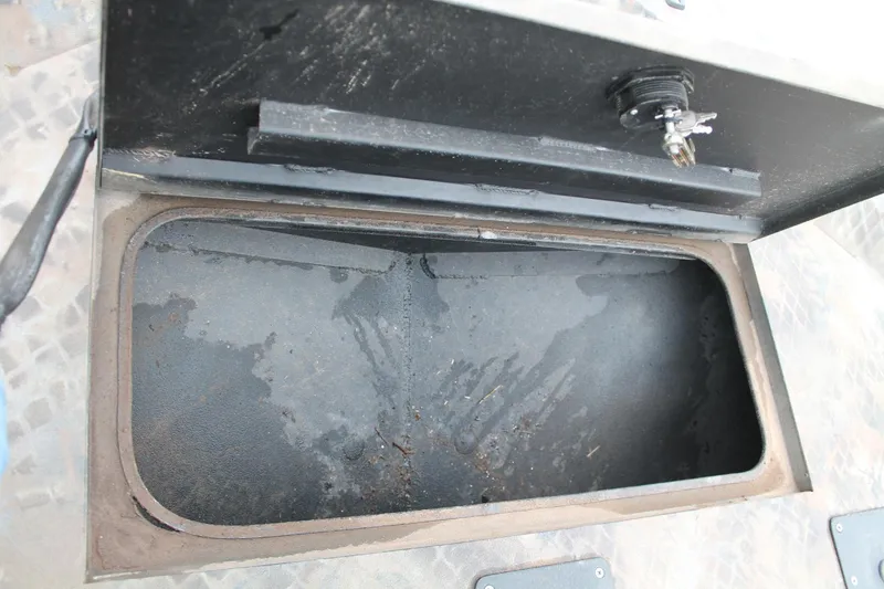 Slide: The Image of Open storage compartment in 2023 Excel Catfish Pro 21 Side Console boat. - 10