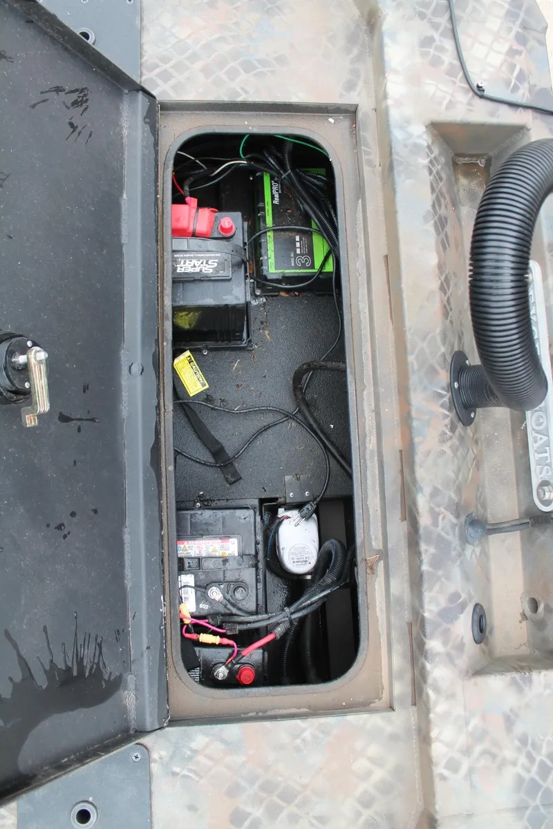 Slide: The Image of Battery compartment of 2023 Excel Catfish Pro 21 Side Console boat. - 15