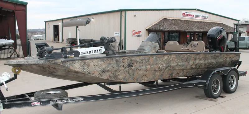 Slide: The Image of 2023 Excel Catfish Pro 21 Side Console boat on trailer at dealership. - 17