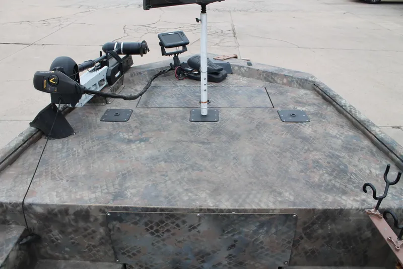 Slide: The Image of 2023 Excel Catfish Pro 21 Side Console boat deck with fishing equipment. - 21