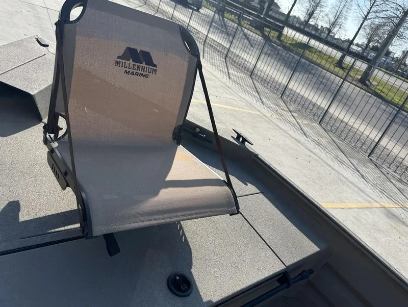 Slide: The Image of 2024 Alweld 1752 Marsh boat with Millennium Marine seat, parked outdoors. - 10