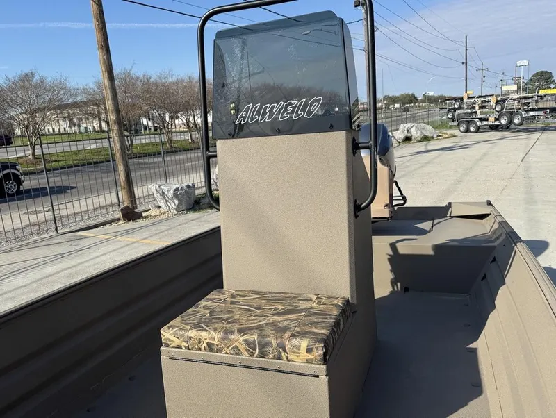 Slide: The Image of 2024 Alweld 1752 Marsh boat interior with camouflage seat and windshield. - 11