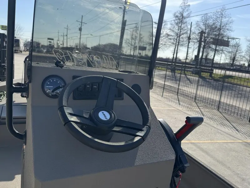 Slide: The Image of 2024 Alweld 1752 Marsh boat dashboard with steering wheel and controls. - 12