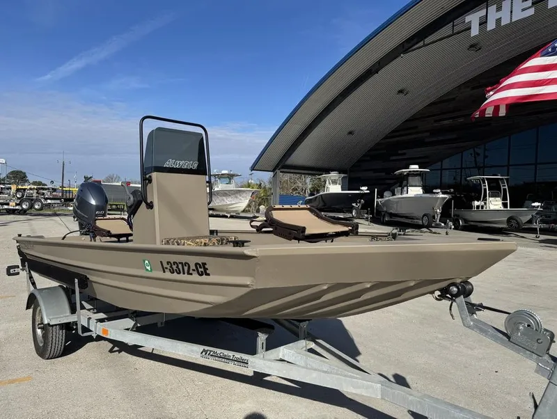 Slide: The Image of 2024 Alweld 1752 Marsh boat on trailer, displayed outdoors near dealership. - 3