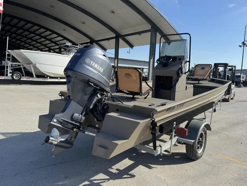 Slide: The Image of 2024 Alweld 1752 Marsh boat with Yamaha motor on trailer in marina. - 4