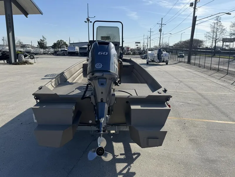 Slide: The Image of 2024 Alweld 1752 Marsh boat with 60 HP motor in a parking lot. - 5