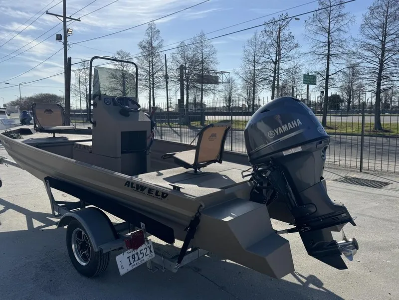 Slide: The Image of 2024 Alweld 1752 Marsh boat with Yamaha outboard motor on a trailer. - 6