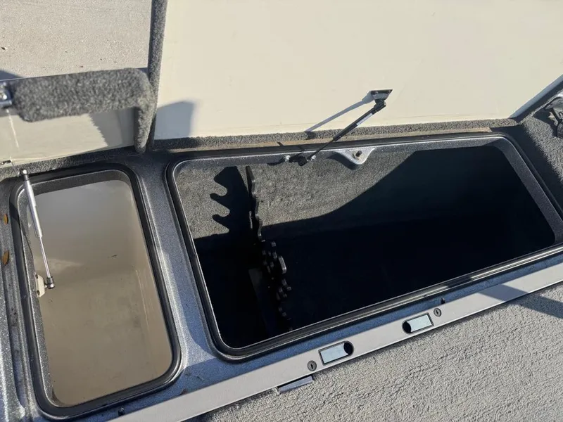 Slide: The Image of Open storage compartments on a 2007 Ranger Z21 Comanche boat. - 10