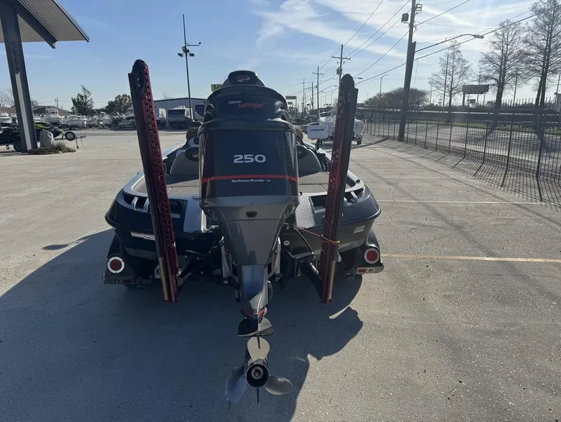 Slide: The Image of 2007 Ranger Z21 Comanche boat with Yamaha 250 engine, parked outdoors. - 14