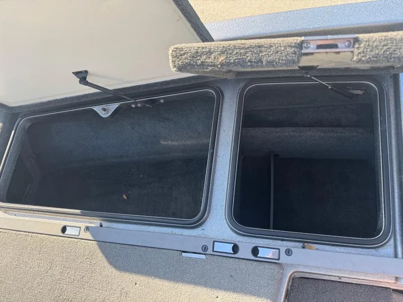 Slide: The Image of Open storage compartments in a 2007 Ranger Z21 Comanche boat. - 8