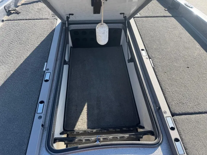 Slide: The Image of Open storage compartment on 2007 Ranger Z21 Comanche boat, featuring carpeted interior. - 9