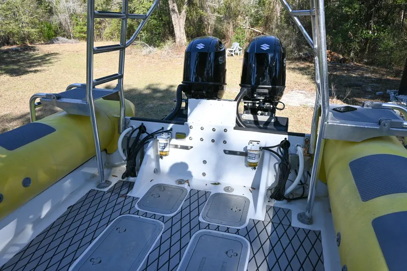 Slide: The Image of 2007 Ribcraft 9.0 boat with dual engines and yellow inflatable tubes. - 10