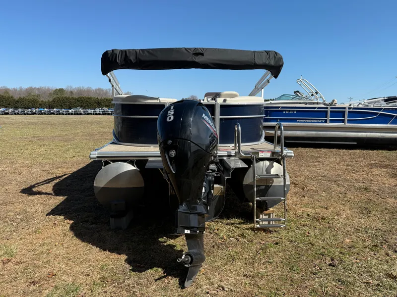 Slide: The Image of 2022 Cypress Cay Seabreeze 232 pontoon boat with outboard motor, parked on grass. - 4