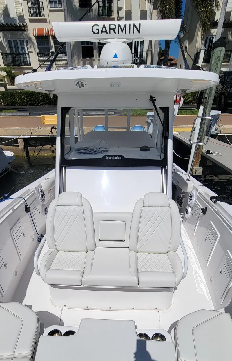 Slide: The Image of 2024 Everglades 365 Center Console boat with Garmin equipment, featuring luxurious seating. - 14