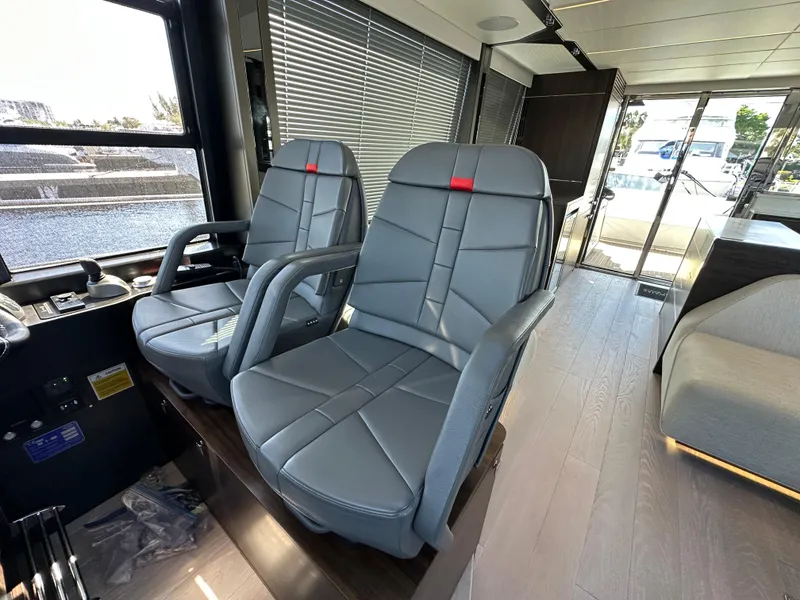 Slide: The Image of Interior of 2023 Sunseeker 65 Sport Yacht with modern seating and sleek design. - 18