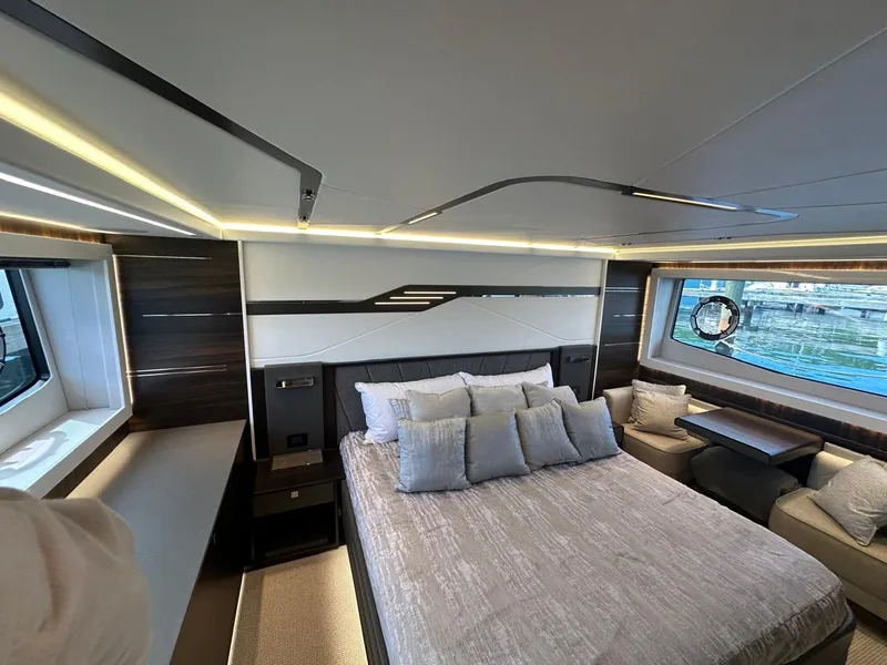 Slide: The Image of Luxurious bedroom interior of 2023 Sunseeker 65 Sport Yacht with modern design and large windows. - 26